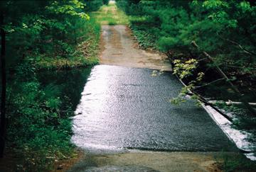 The emergency overflow spillway, now the outflow from the lake