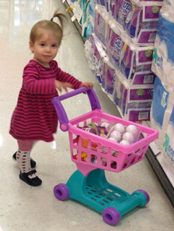 Darwin pushing a small shopping cart