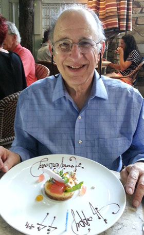 Larry at the Harvest behind his dessert plate