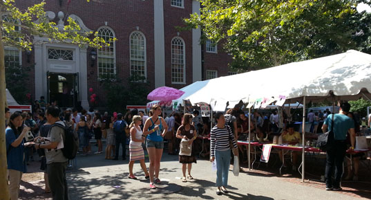 A tent, with people milling about